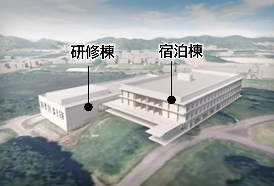鳥瞰図で描かれた研修棟と宿泊棟の施設外観です。二つの建物が連結しており、それぞれの名称が示されています。