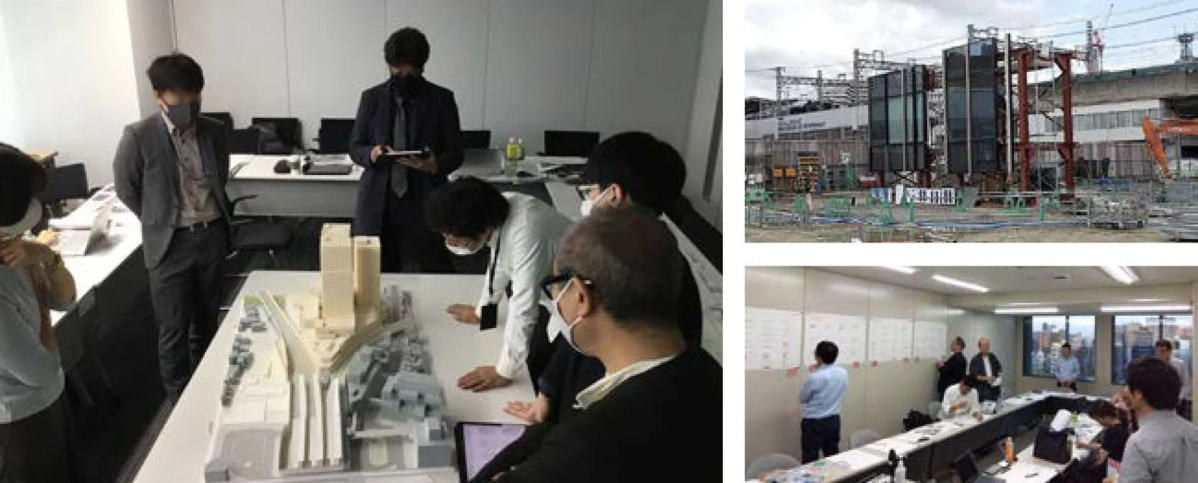 オフィスで建築模型を囲んで議論する様子