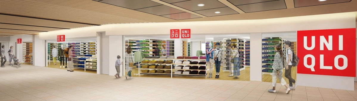 ユニクロの店舗内部の様子を捉えた画像です。店内には多数の衣料品が棚に綺麗に陳列されており、買い物客やマネキンが複数見られます。明るく広々とした空間で、アパレルショップの活気ある雰囲気が伝わってきます。
