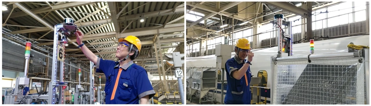 工場内で安全帽と保護メガネを着用した作業員が、産業機器の点検や調整を行っています。